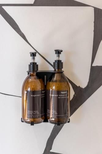two bottles of soap hanging from a ceiling at Висота890 in Volosyanka