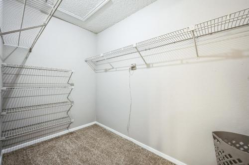 a storage room with stairs in the ceiling at 3001 Crystal Springs 922 I Spacious 1 Bed 1 Bath in Bedford