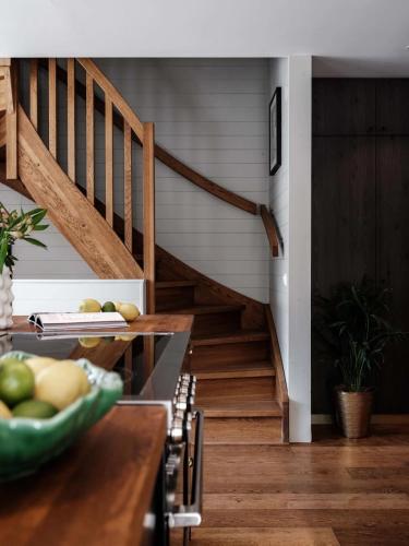 a kitchen with wooden stairs and a bowl of fruit at Ski lodge Åre by in Åre
