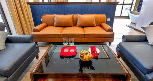 a living room with a couch and a coffee table at LCV Mũi Né Resort in Mui Ne