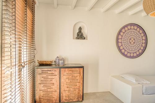 a room with a wooden cabinet and a window at Santa Maria Hotel in Elia Beach