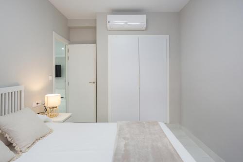 Katil atau katil-katil dalam bilik di Apartamento grande xeraco playa