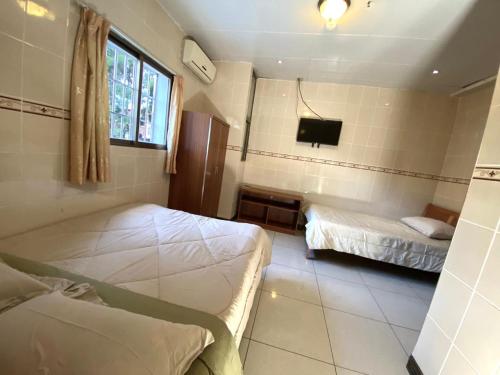 Postel nebo postele na pokoji v ubytování Hotel Guanacaste