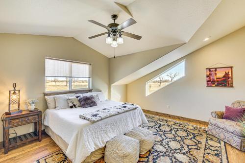 a bedroom with a bed and a ceiling fan at Riverside Retreat in Bridgeport with Game Room! in Bridgeport