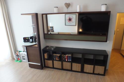 a large entertainment center with a flat screen tv at Pension Markgrafenmühle in Cottbus