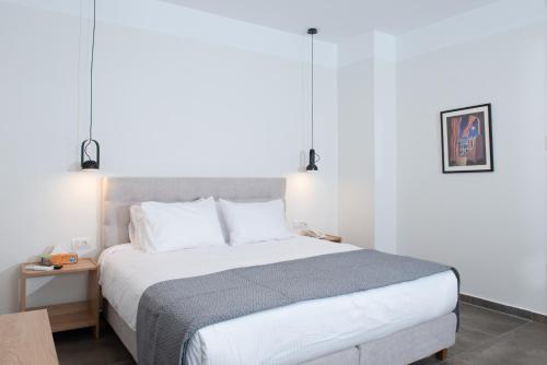 Postel nebo postele na pokoji v ubytování Evia Hotel