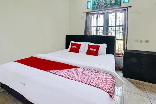 Кровать или кровати в номере Hotel O Archi Homestay