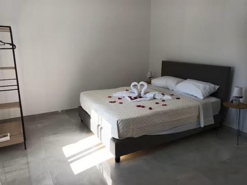 a bedroom with a bed with flowers on it at The Sun House in Paradisi in Rhodes Town