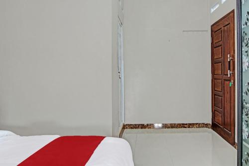 Postel nebo postele na pokoji v ubytování Hotel O Elisa Hill