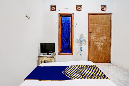 Телевизор и/или развлекательный центр в Hotel O Tarlo Guest House 4
