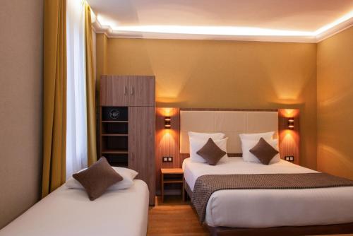 Una cama o camas en una habitación de Hotel Cactus