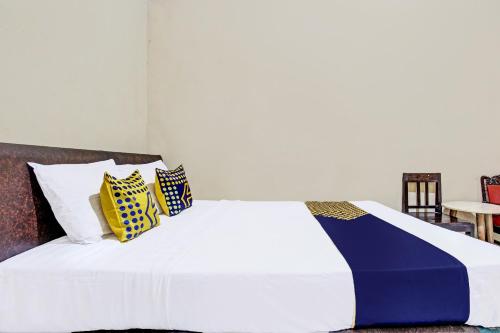 Ένα ή περισσότερα κρεβάτια σε δωμάτιο στο Hotel O Indah Arum