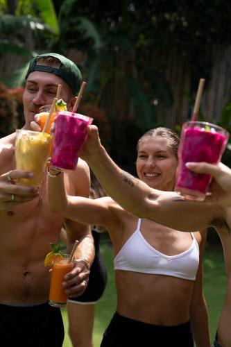 a group of people holding up glasses of drinks at Neano Escape in Candidasa