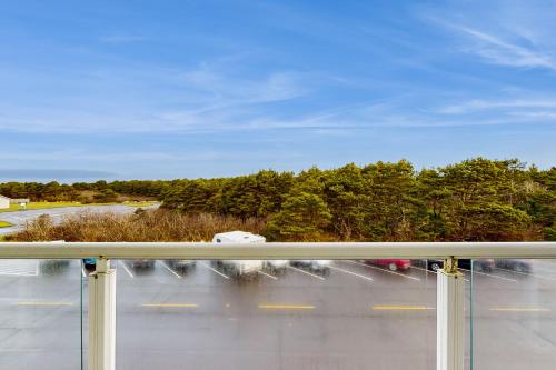 a view of a parking lot from a window at Lighthouse Views in Westport