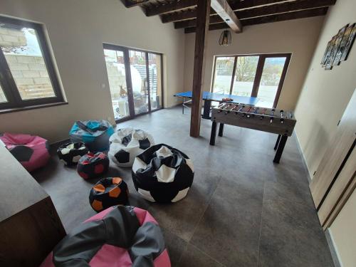a room with several soccer balls on the floor at Vila LiMi in Oščadnica