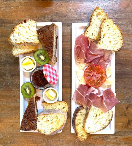 a plate of food with different types of bread at La Lupa e l'Orso in Berceto