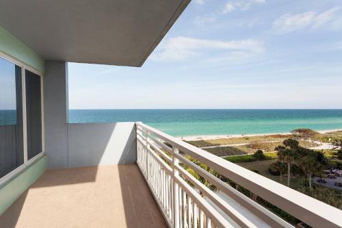 a balcony with a view of the ocean at Solara Surfside in Miami Beach