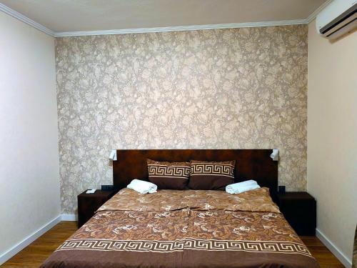 a bedroom with a large bed in a room at Sofia hotel apartments in Sofia