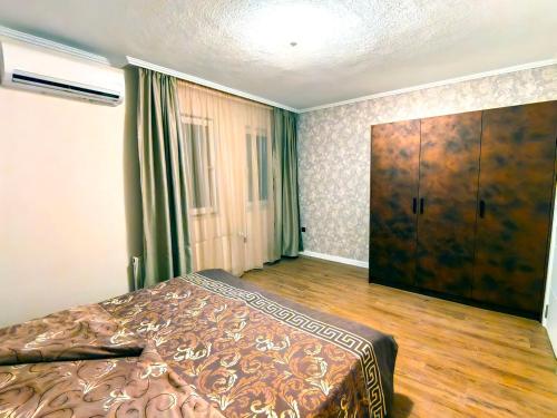 a bedroom with a bed and a large closet at Sofia hotel apartments in Sofia