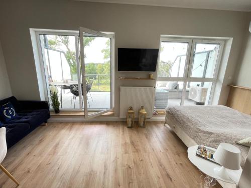 TV/trung tâm giải trí tại Blue Sky Apartment & SPA Dziwnów