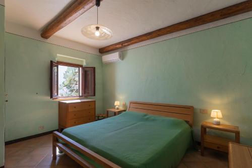 Postel nebo postele na pokoji v ubytování Casa Natura & Relax - HelloElba