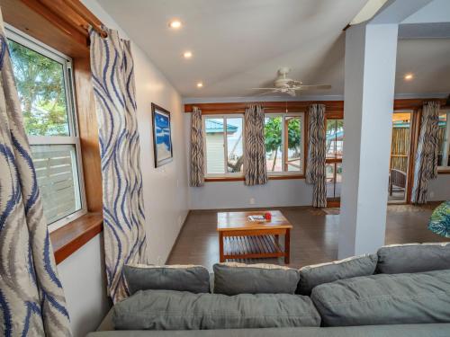 a living room with a couch and a table at Maya Beach Hotel in Maya Beach