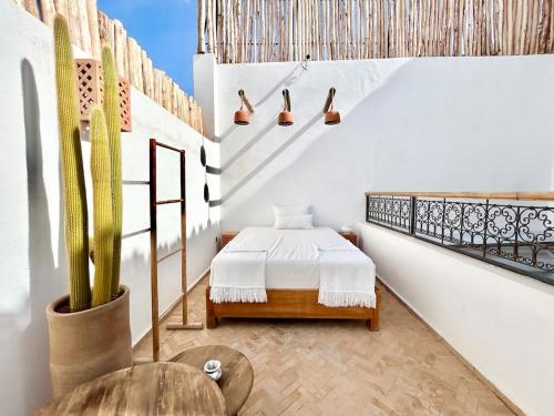 Ένα ή περισσότερα κρεβάτια σε δωμάτιο στο Riad Fleur de Kasbah