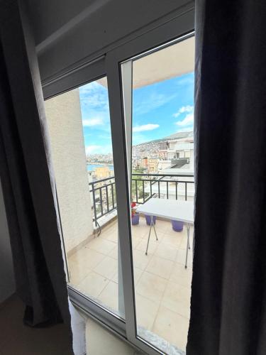 a view of a balcony from a window at Azalea Apartments in Sarandë