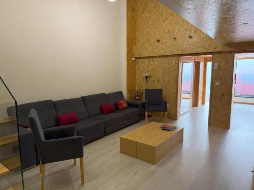 a living room with a couch and a table at Porto Encanto- 7 Bedrooms in Porto