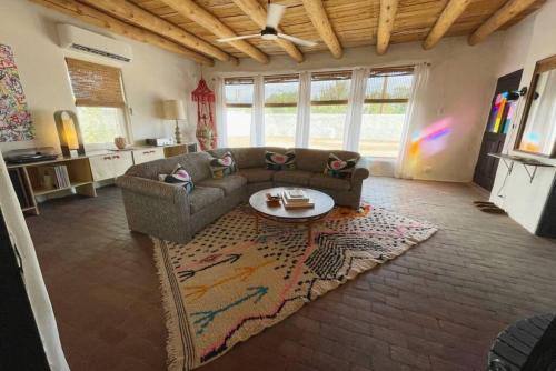 a living room with a couch and a table at Spacious Stylish Niji Suite in Santa Fe