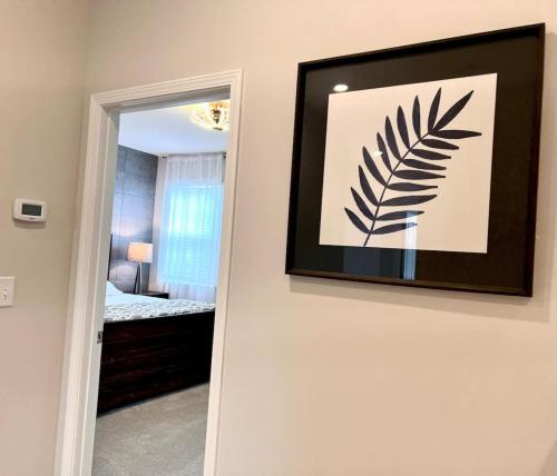 a hallway with a picture of a bedroom at The Villas The One Villa by RDU Airport with Indoor Heated Pool and Gym in Durham