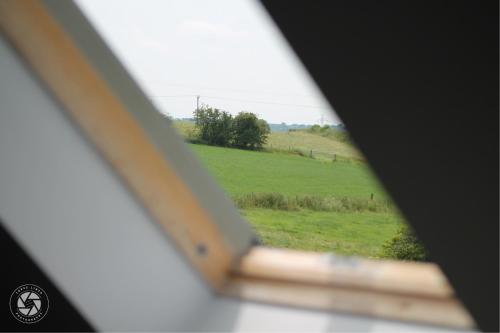 a view of a field from a window at Home with HotTub near AltonTowers & Waterworld sot in Stoke on Trent