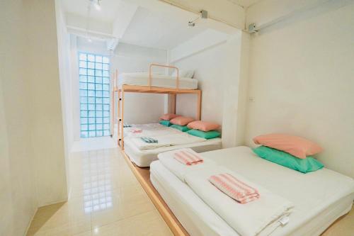 Postel nebo postele na pokoji v ubytování Old Town Sunday Stay Bangkok