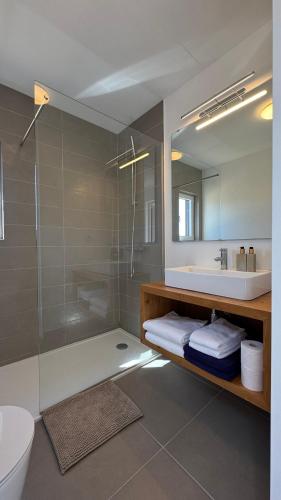 a bathroom with a shower and a sink and a toilet at LAZY HIKERS by Nature Bliss in São Luis