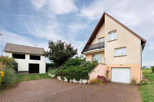 a large house with a driveway in front of it at Charly's House - Parking et terrasse in Houssen
