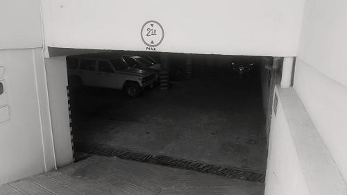 a garage with a car parked inside of it at Hotel Primavera in Floridablanca