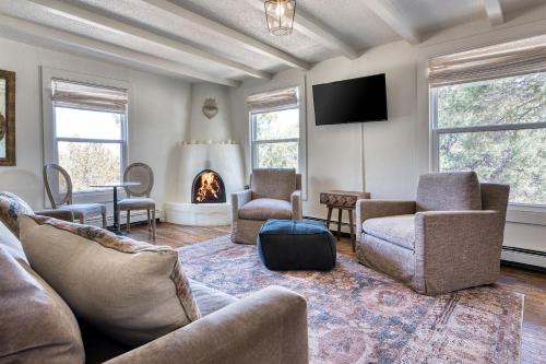 a living room with a couch and chairs and a fireplace at Tesuque Outpost Casita E Best views in Santa Fe in Santa Fe