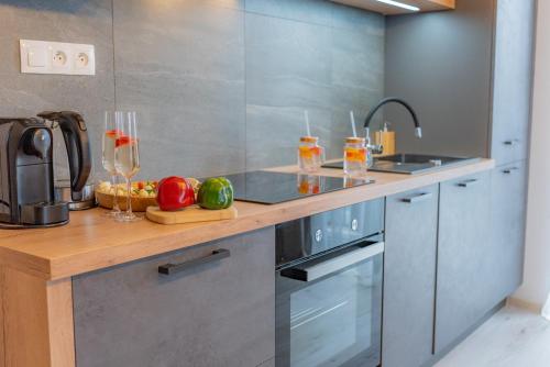 a kitchen with a counter with fruits and drinks at Miracle Seasons in Liptovský Mikuláš
