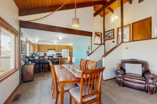 a dining room and living room with a table and chairs at Seaside Serenity Near the Sea in Seaside