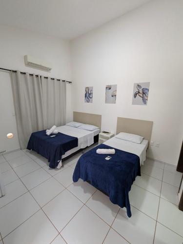 Ένα ή περισσότερα κρεβάτια σε δωμάτιο στο Pousada Costa Prestige