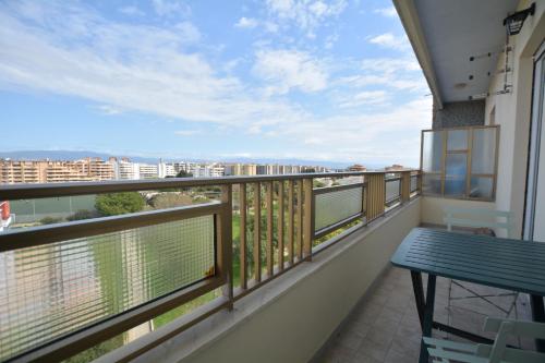 a balcony with a table and a view at 7th Floor - Donoratico in Cagliari