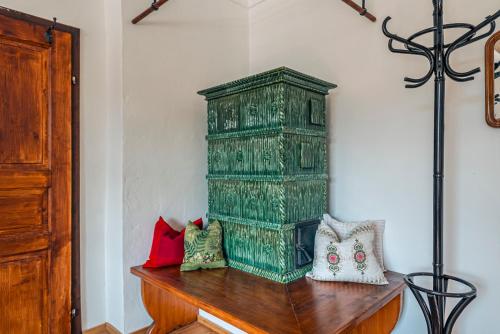 a green cabinet sitting on top of a wooden table at SIEGLGUT in Altaussee