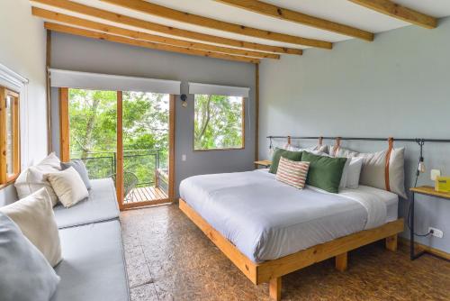 Una cama o camas en una habitación de Hotel La Palma y El Tucán - Café y Naturaleza