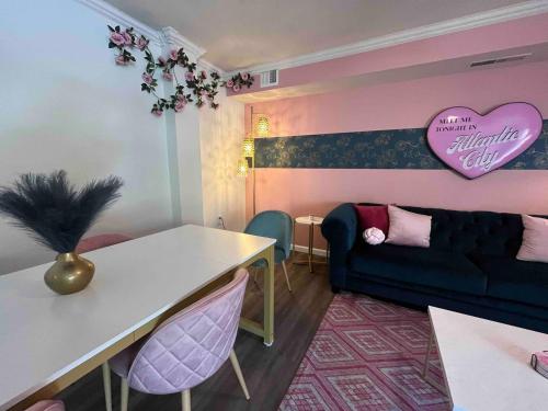 a living room with a couch and a table at Pretty Posh Pad-Block to Ocean Casino & Waterpark in Atlantic City