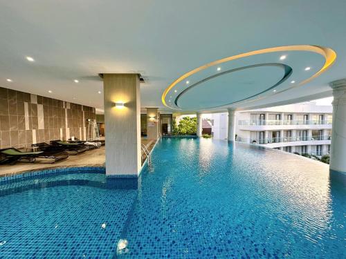 a swimming pool in a building with a building at Sunset Beach Resort and Spa in Phu Quoc