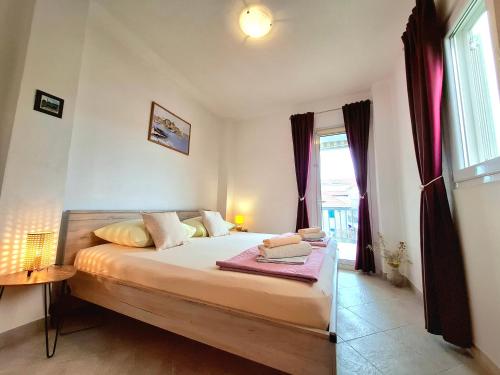 Postel nebo postele na pokoji v ubytování Cozy 1-bedroom apartment near the center of Trogir