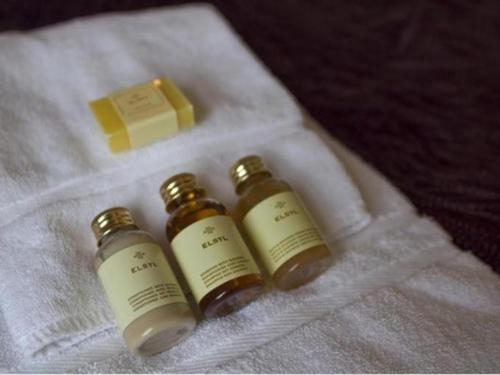 two bottles of essential oils and a block of cheese at Anchor Hotel Haydon Bridge in Hexham