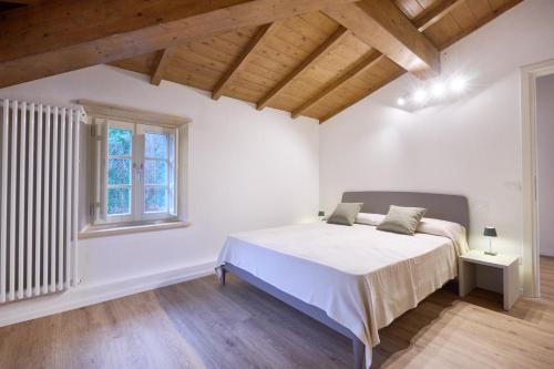 Ένα ή περισσότερα κρεβάτια σε δωμάτιο στο Residenza alla Piana