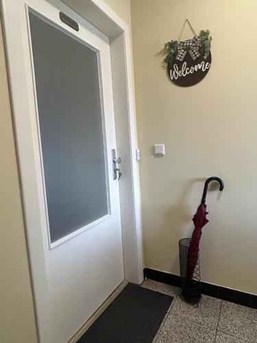 an umbrella is standing next to a door at Fewo-H41 in Korschenbroich