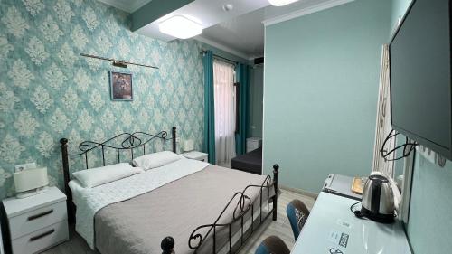 Postel nebo postele na pokoji v ubytování Nicolas Boutique Hotel